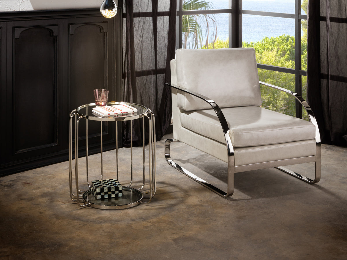Mesa auxiliar Hadas de acero con acabado brillante. Diseño contemporáneo, ideal para salón o dormitorio. Modelo 296243 de Schuller.