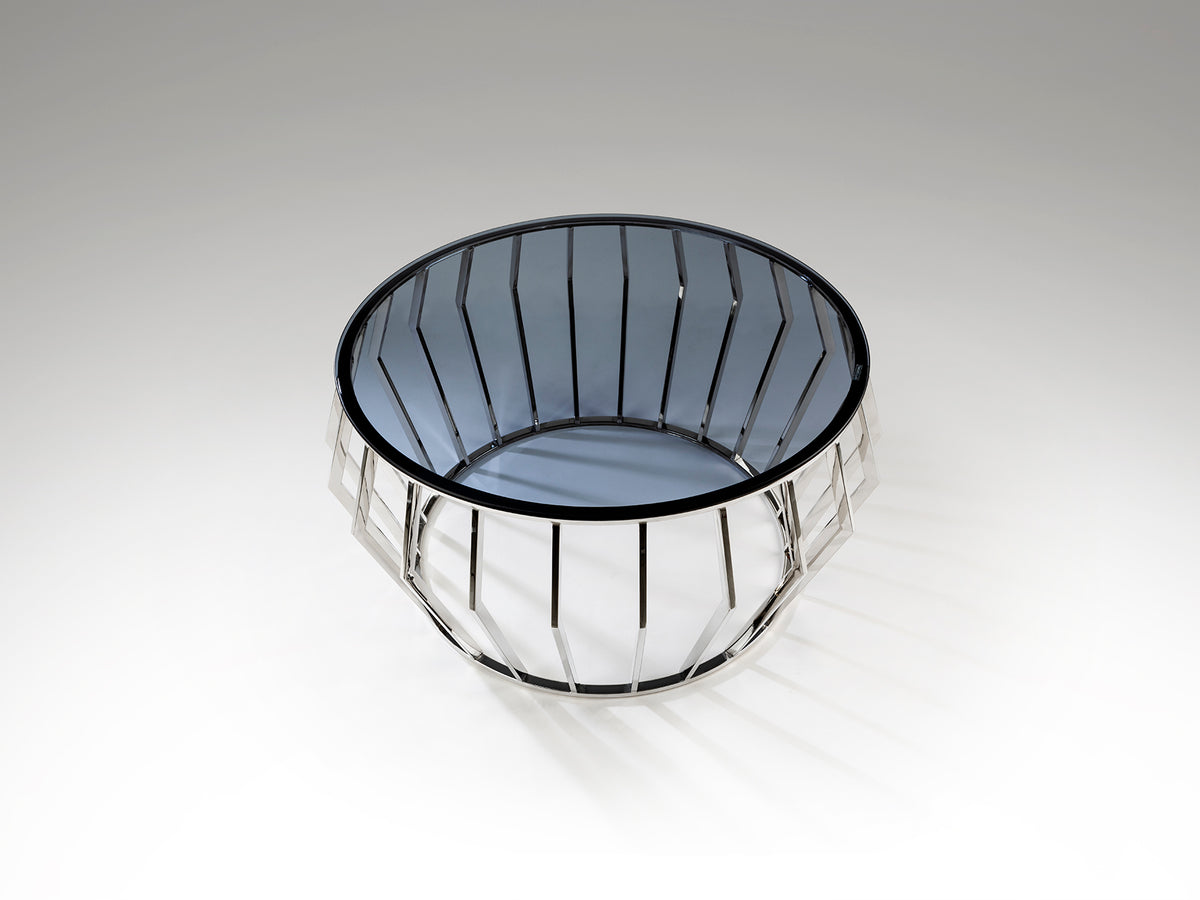 Mesa de centro Ciros pulido brillo con cristal Smoke y diseño moderno de Schuller, fabricada en acero inoxidable, ideal para salones contemporáneos.